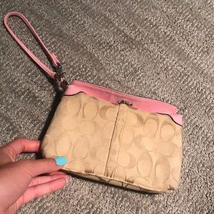 Coach wristlet with baby pink detailing